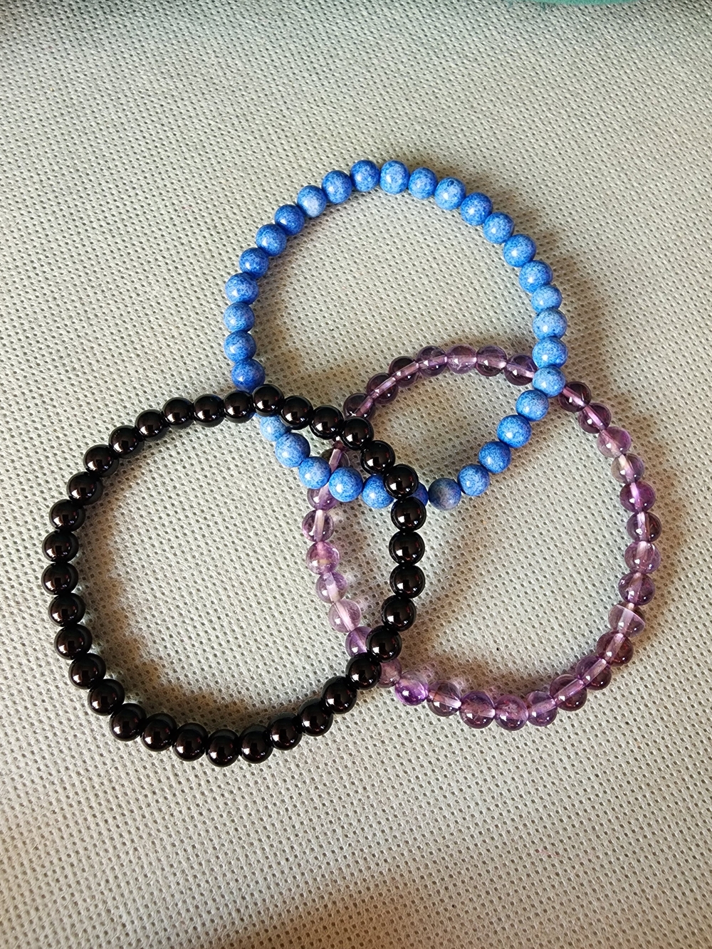Set of Three Beaded Stretch Bracelets - Blue, Purple, Black
